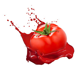 Image showing Red tomato with juice splash isolated on white