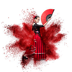 Image showing young woman dancing flamenco against explosion