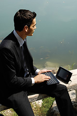 Image showing man with laptop on the nature