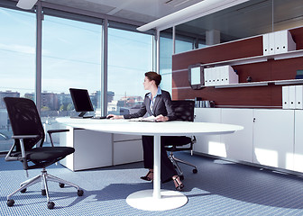 Image showing businesswoman working in her office az