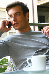 Image showing smiling man having lunch