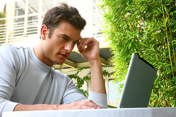 Image showing young man and laptop