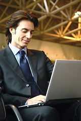 Image showing businessman sitting in the airport b