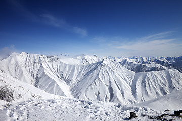 Image showing Winter snowy mountains and blue sky