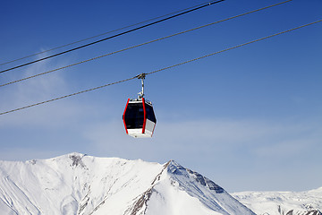 Image showing Gondola lift and snowy mountains