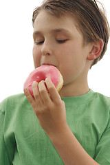 Image showing Child eating a doughnut