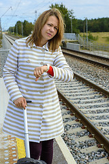 Image showing Portrait of a beautiful woman waiting the train