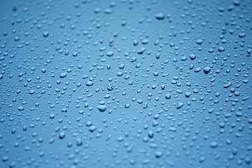 Image showing Natural water drops on glass