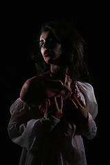 Image showing Psychotic Bleeding Woman in a Horror Themed Image