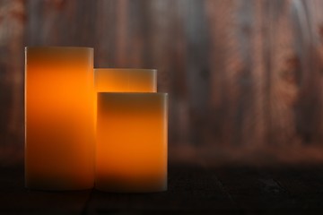 Image showing Lit Candle on an Old Wooden Rustic Background