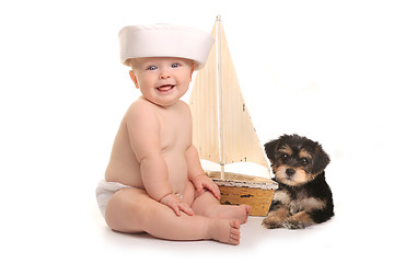 Image showing Adorable Baby Boy With His Pet Teacup Yorkie Puppy