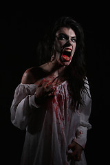 Image showing Psychotic Bleeding Woman in a Horror Themed Image