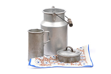 Image showing Graduated jug and milk can