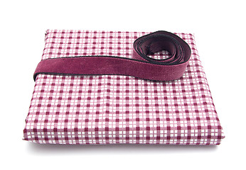 Image showing Purple band on a checked cloth