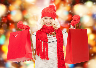 Image showing teenage girl in winter clothes with shopping bags