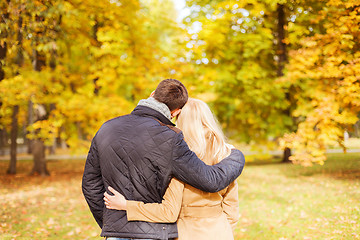 Image showing couple hugging in autumn park from back