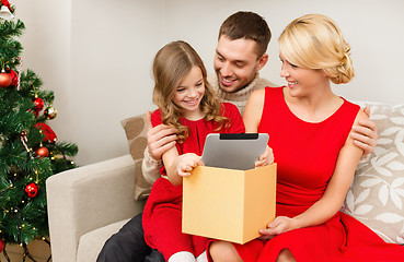 Image showing smiling family with tablet pc