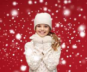 Image showing smiling girl in white hat, muffler and gloves
