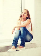 Image showing girl with smartphone at school