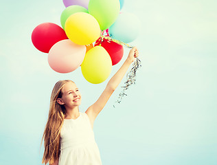 Image showing happy girl with colorful balloons