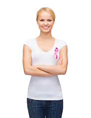 Image showing smiling woman with pink cancer awareness ribbon