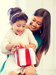 Image showing happy mother and child girl with gift box