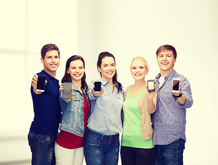 Image showing students showing blank smartphones screens