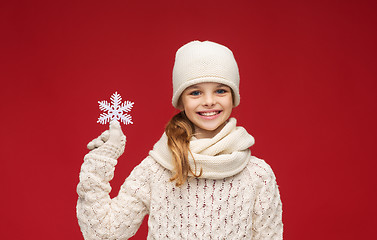 Image showing girl with big snowflake