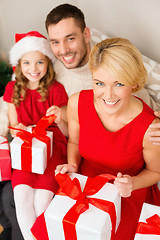 Image showing happy family opening gift boxes