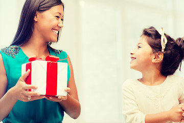 Image showing happy mother and child girl with gift box