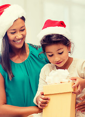 Image showing happy mother and child girl with gift box