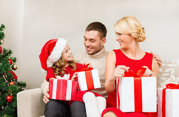 Image showing happy family opening gift boxes