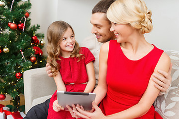 Image showing smiling family with tablet pc