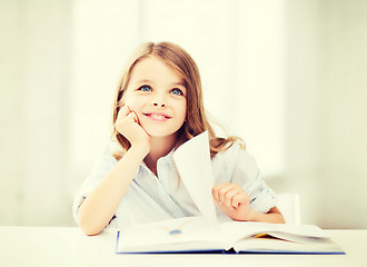 Image showing little student girl studying at school