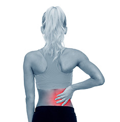 Image showing sporty woman touching her back