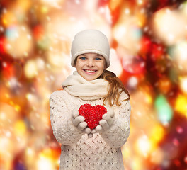 Image showing girl in winter clothes with small red heart