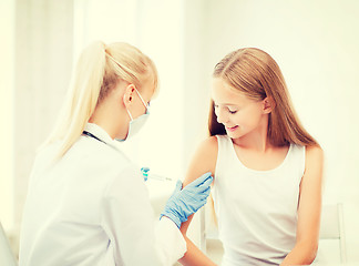 Image showing doctor doing vaccine to child in hospital