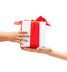 Image showing close up of child and mother hands with gift box