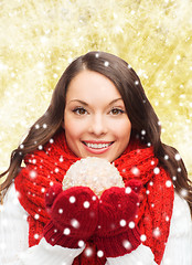 Image showing smiling woman in winter clothes with snowball