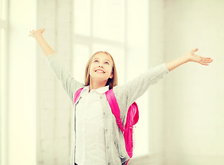 Image showing student girl with hands up at school