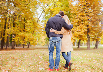 Image showing couple hugging in autumn park from back