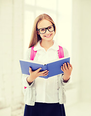 Image showing girl reading book at school