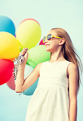 Image showing happy girl with colorful balloons