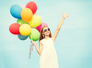 Image showing happy girl with colorful balloons