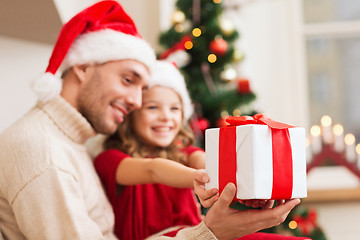 Image showing close up of father and daughter with gift box