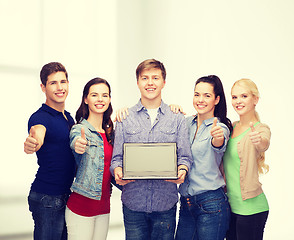 Image showing smiling students with laptop computer