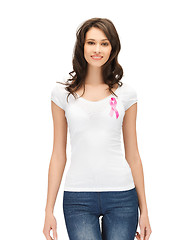 Image showing smiling woman with pink cancer awareness ribbon