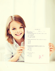 Image showing girl with test and grade at school