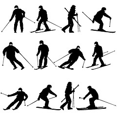 Image showing Mountain skier  man speeding down slope. Vector sport silhouette