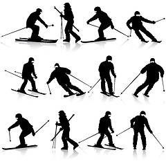 Image showing Mountain skier  man speeding down slope. Vector sport silhouette